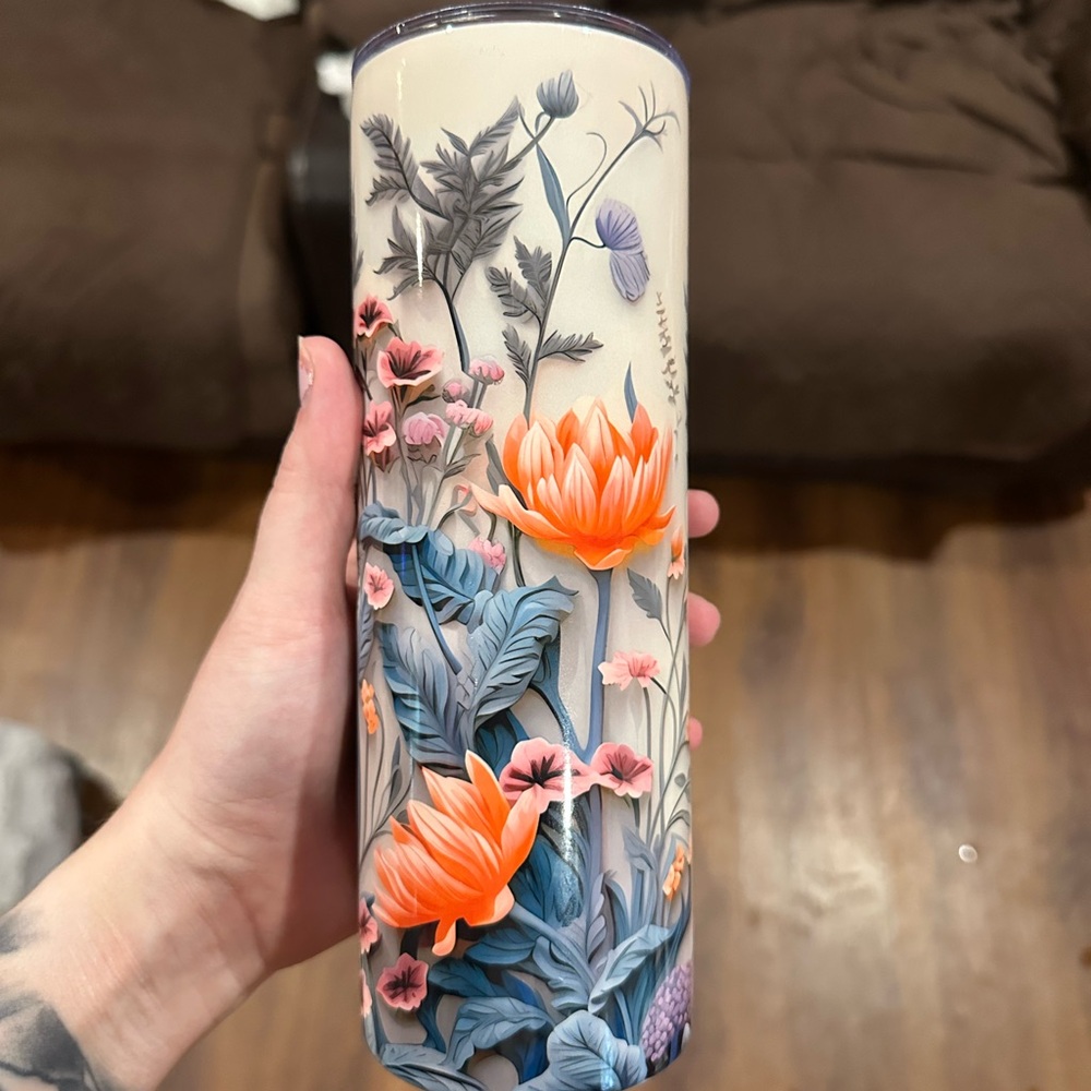 Floral Tumbler with Orange and Blue Design